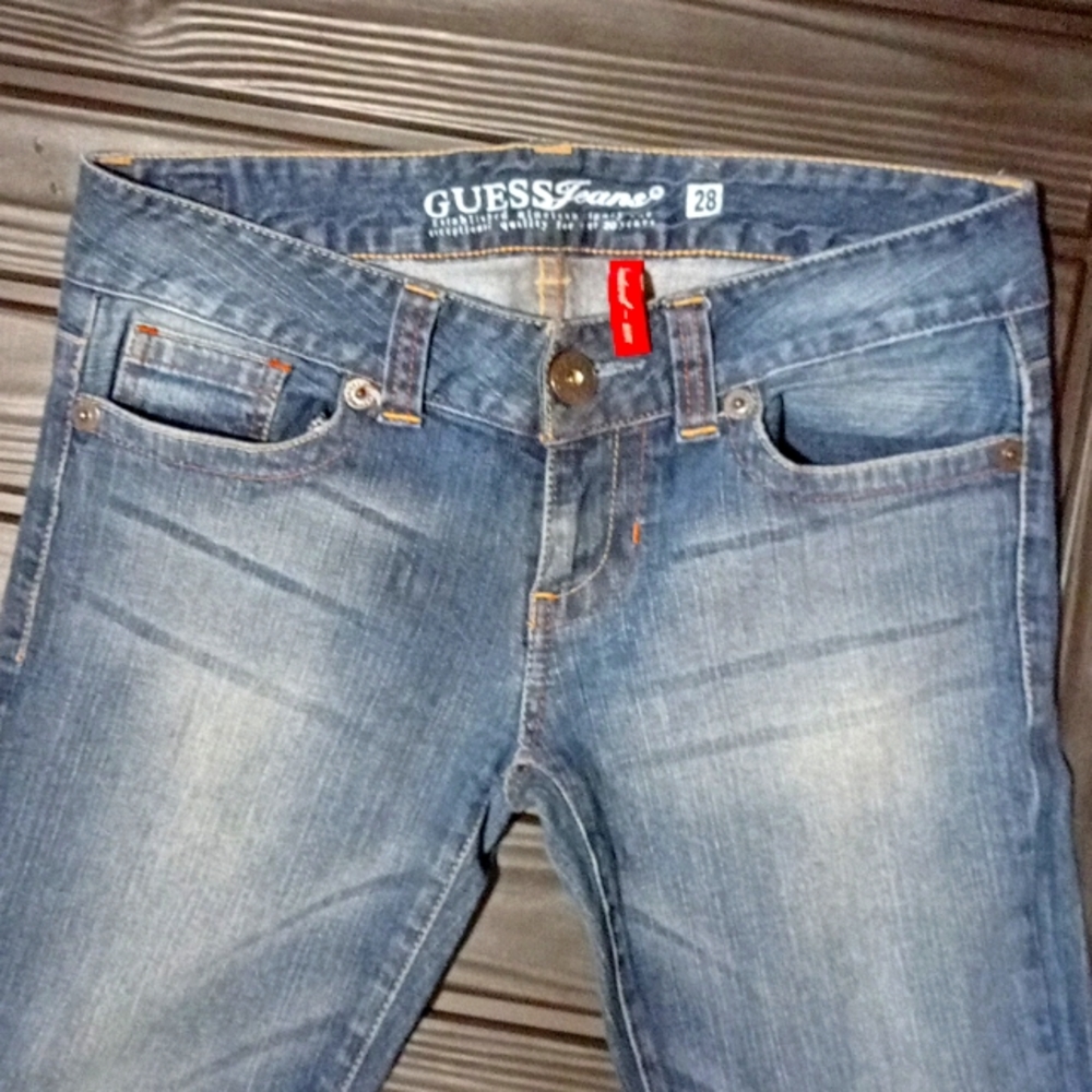 Guess boot cut or flare dark wash jeans.  Tag says size 28 waist more like 26